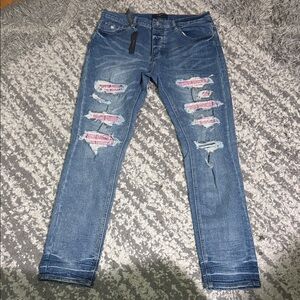 AMIRI Blue Distressed Skinny Jeans